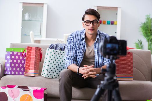 Male fashion blogger recording video for vlog