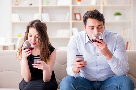 Young pair drinking wine in romantic concept