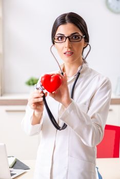 Young doctor in heart care concept