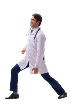 Young handsome doctor under pressure isolated on white