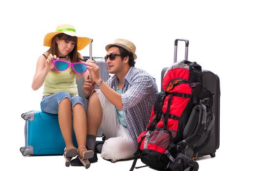 Young family preparing for vacation travel on white