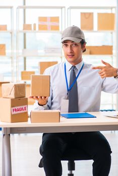 Male employee working in box delivery relocation service