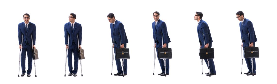 Businessman walking with crutches isolated on white background