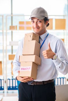 Male employee working in box delivery relocation service