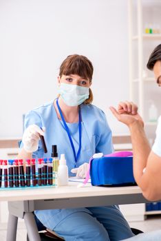 Young patient during blood test sampling procedure  