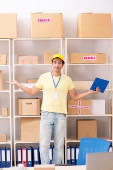 Handsome contractor working in box delivery relocation service 