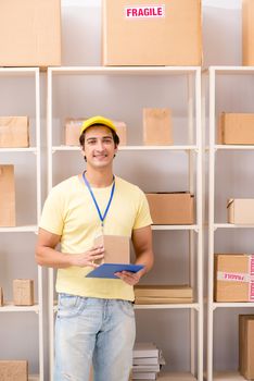 Handsome contractor working in box delivery relocation service 