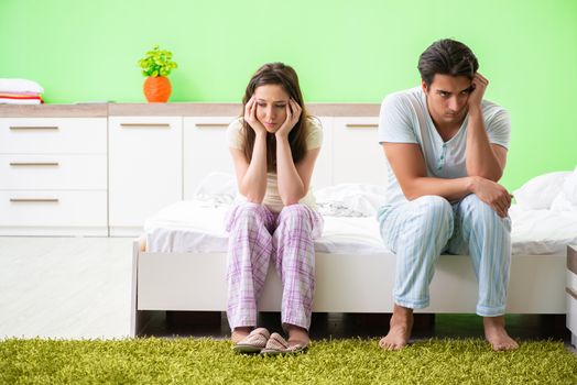 Woman and man in the bedroom after conflict
