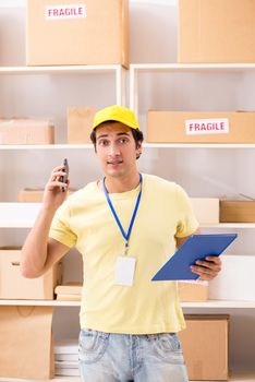 Handsome contractor working in box delivery relocation service 