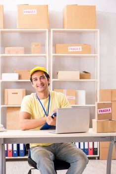 Handsome contractor working in box delivery relocation service 