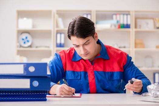Worker in uniform working on project
