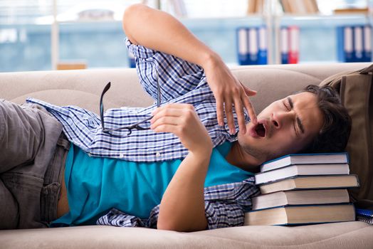 Tired student lying on the sofa 