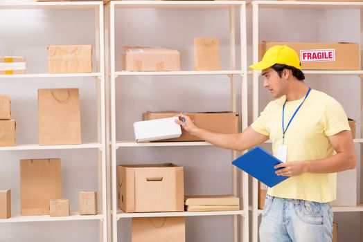Handsome contractor working in box delivery relocation service 