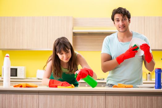Young couple working at kitchen 