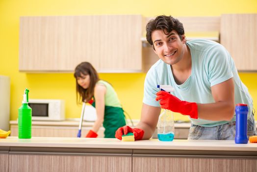 Young couple working at kitchen 