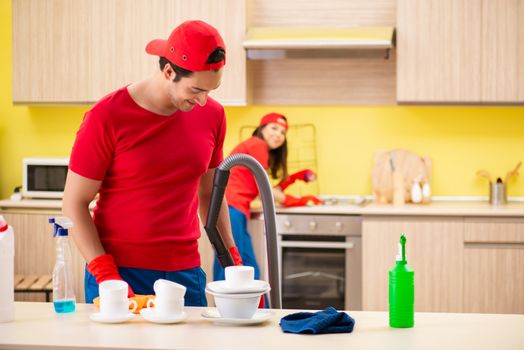 Cleaning professional contractors working at kitchen