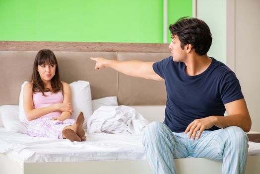 Woman and man in the bedroom during conflict