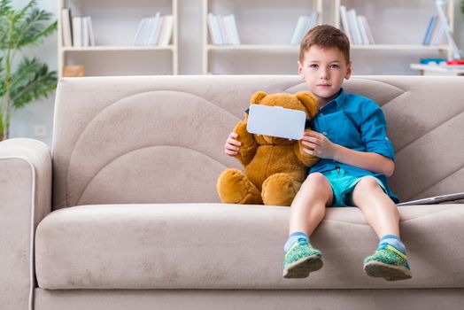 Young little boy with VR virtual reality glasses