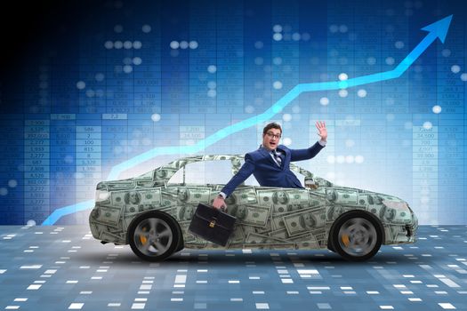 Businessman driving car covered with us dollars