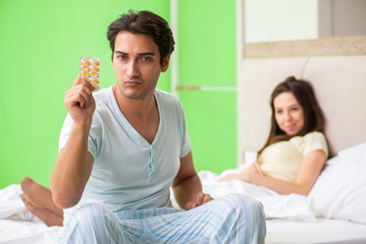 Man using pills for woman satisfaction  