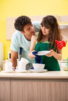 Young couple working at kitchen 