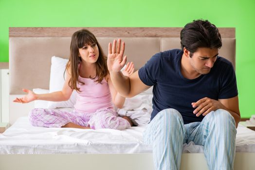 Woman and man in the bedroom during conflict