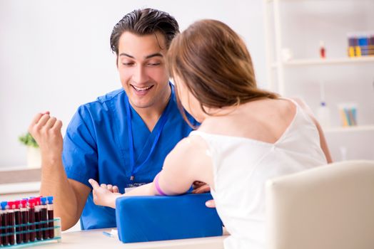 Young patient during blood test sampling procedure  