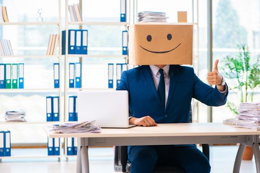 Happy man with box instead of his head