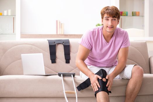 Injured man recovering at home from sports injury