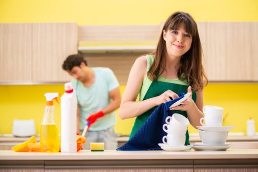 Young couple working at kitchen 