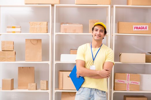 Handsome contractor working in box delivery relocation service 