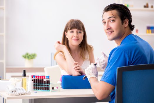 Young patient during blood test sampling procedure  
