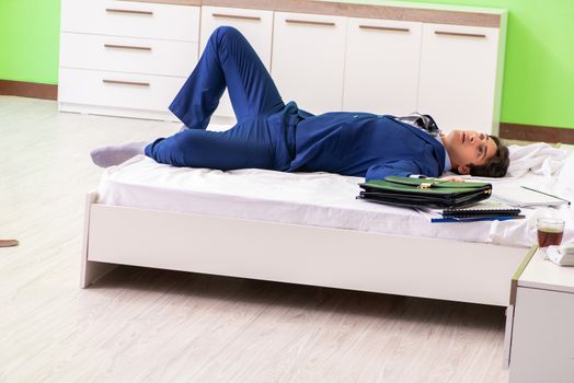 Businessman working overtime in hotel room