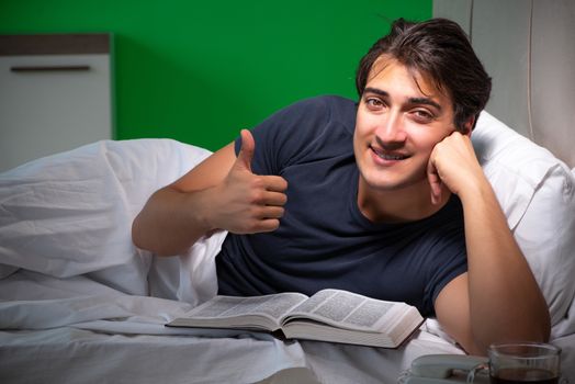 Young handsome man suffering from insomnia at home