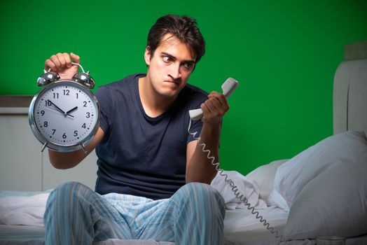 Young handsome man suffering from insomnia at home