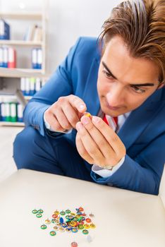 Office prank with sharp thumbtacks on chair