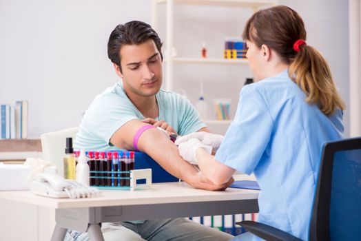 Young patient during blood test sampling procedure  