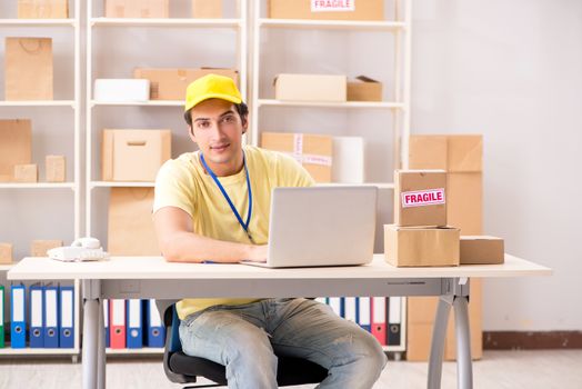 Handsome contractor working in box delivery relocation service 