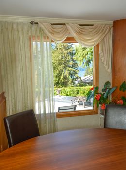 Wooden interior of luxury residential house with scenery view through the window