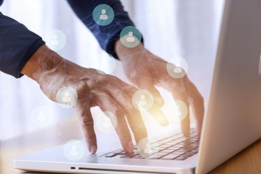 Business and social network concept. Businessman hands with laptop and social network map tree graph background. Businessman hands use computer network contact with customer and partners all the word.
