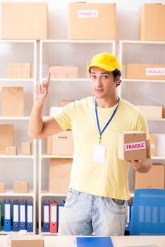 Handsome contractor working in box delivery relocation service 