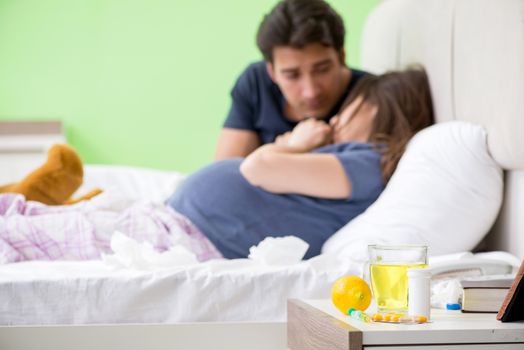 Young husband looking after his pregnant wife