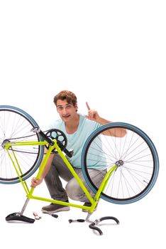 Man repairing his bike isolated on white background