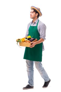 Young farmer with fresh produce isolated on white background