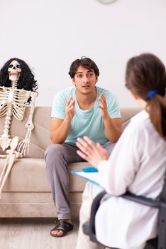 Young patient visiting psychologist for therapy