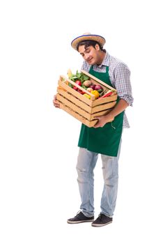 Young farmer with fresh produce isolated on white background