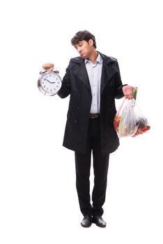 Young handsome man with vegatables in shopping concept 