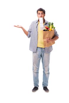 Young man with his grocery shopping on white