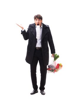 Young handsome man with vegatables in shopping concept 