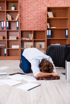 Unhappy businessman sitting in the office 
